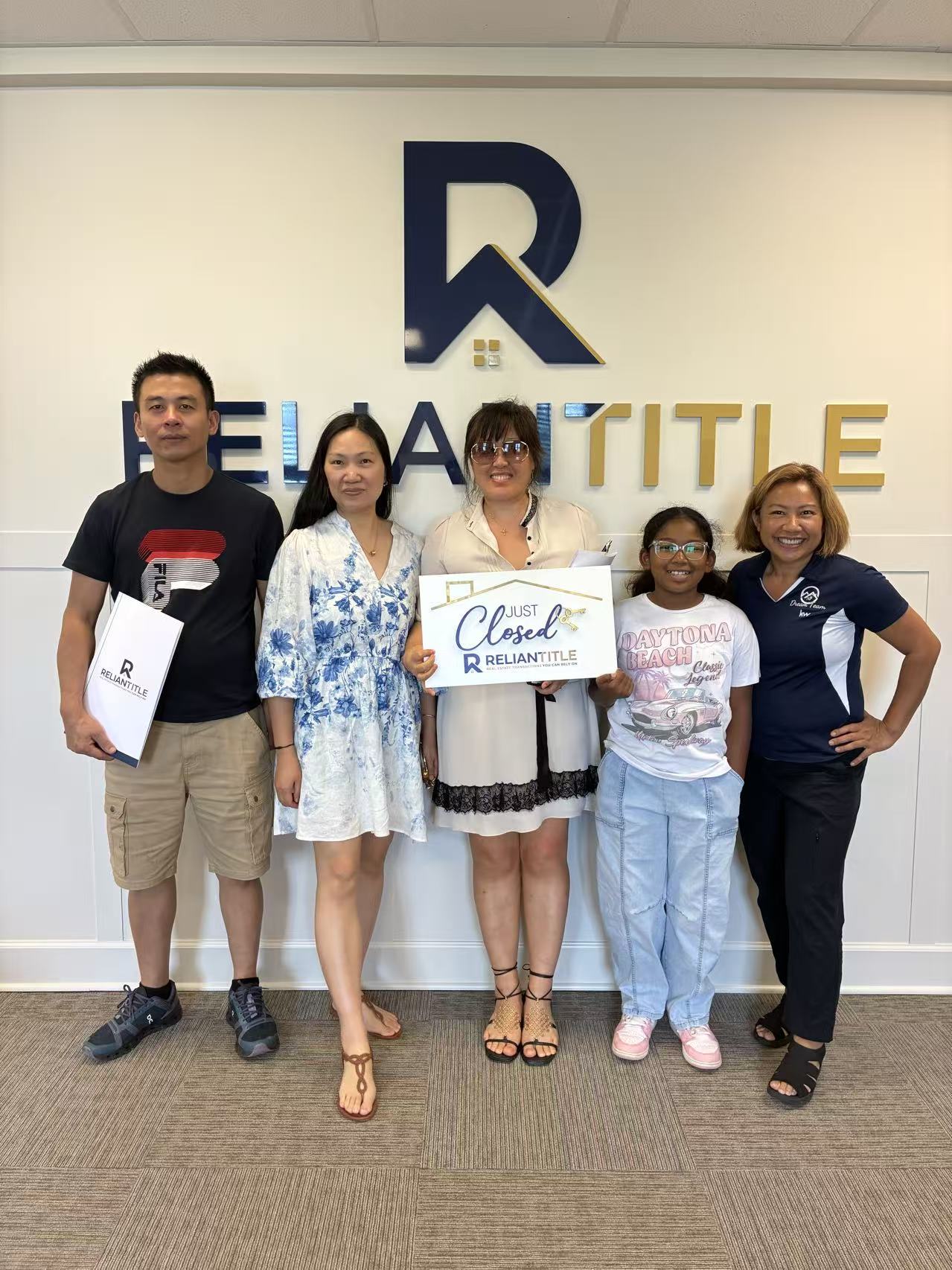 Clients celebrating their closing with the Beyond Realty team at Reliant Title